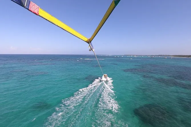 Parasailer launched from a luxury yacht over the Caribbean Sea on the Parasailing Yacht Experience in Punta Cana, Dominican Republic