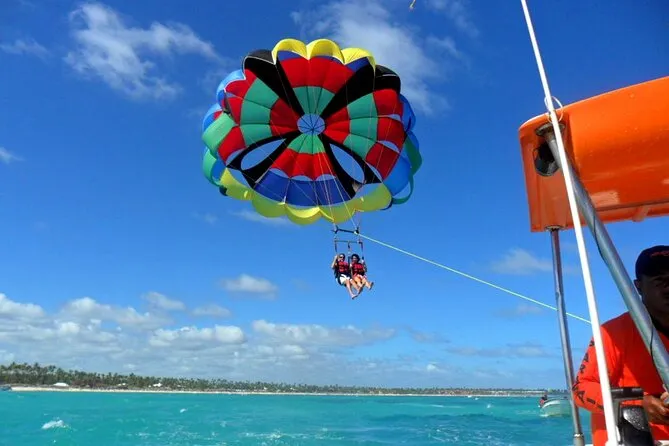 Parasailer above Bávaro Beach on the Cap Cana pickup parasailing adventure in Punta Cana Dominican Republic with panoramic Caribbean views